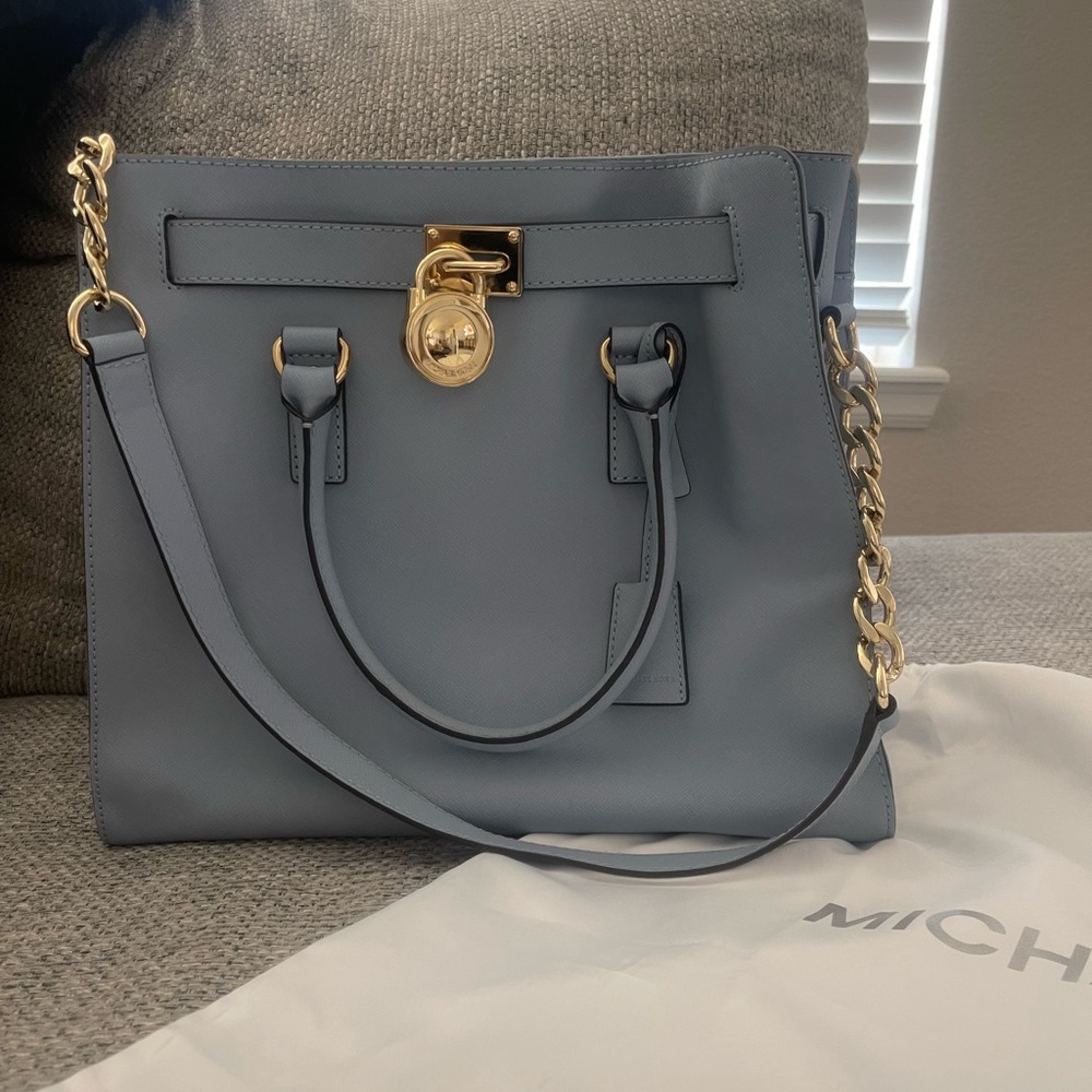 Michael Kors blue leathered purse with brass accents